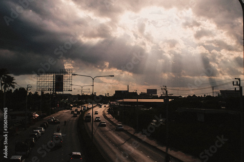 August 2019,Bangkok Thailand Sun rays shining thru dramatic clouds scanning city of Bangkok below s.God message concept idea. Nature spiritual background. Traffic in city