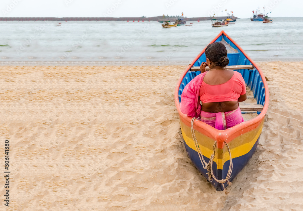 Middle Aged South Indian Woman, wearing Ethnic Saree draped in Marathi style, waiting in
