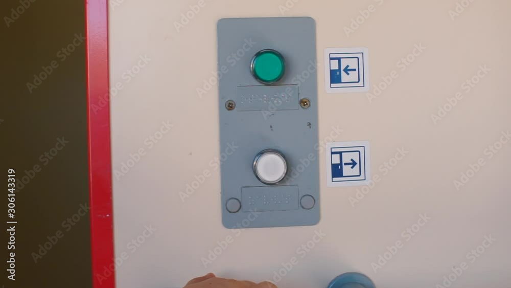 Close-up of pressing the door open button on a train. Close-up of pressing the door open button on a train.