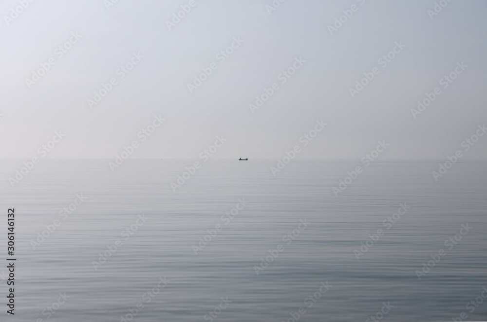 Fishing boat on a background of sky and sea