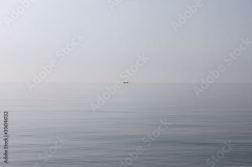 Fishing boat on a background of sky and sea © Элис