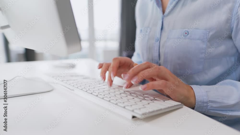 Female hands typing on a computer keyboard Female hands typing on a computer keyboard