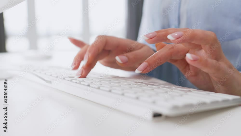 Female hands typing on a computer keyboard Female hands typing on a computer keyboard