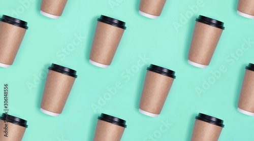 A pattern from a disposable coffee Cup on a minty background.
