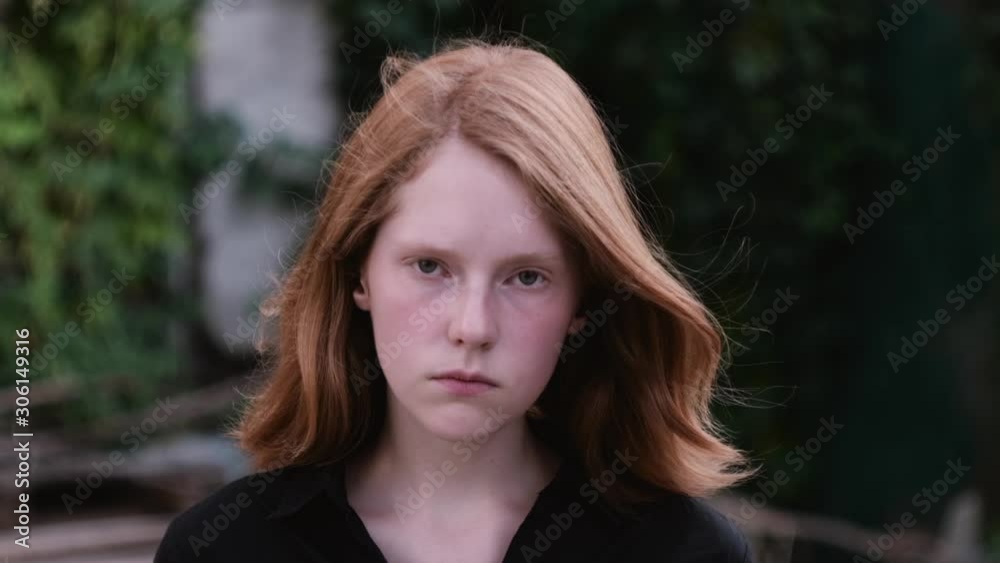 portrait of young sad girl in backyard garden at dark place portrait of young sad girl in backyard garden at dark place