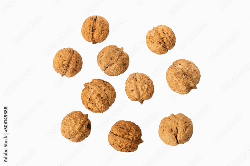 many walnuts on white background many walnuts on white background