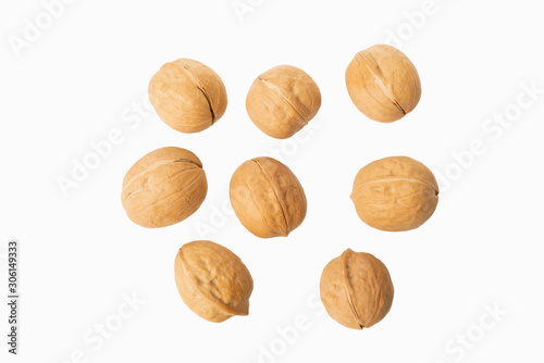 many walnuts on white background
