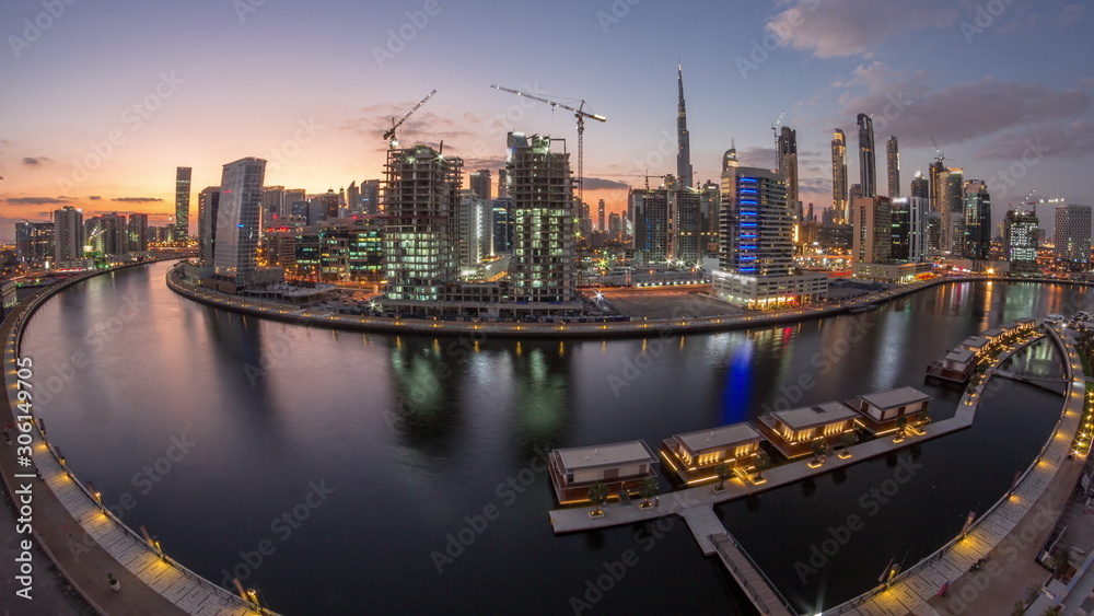 Fototapeta premium Dubai city center at sunset near river aerial timelapse