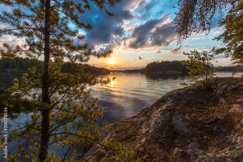 A sunset view of Eagle Lake from the top of a large granite outcropping on an unnamed island located in Northwest Ontario, Canada.