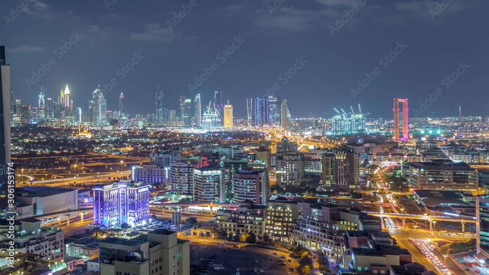 Fototapeta premium Nighttime view of lights in luxury Dubai city, United Arab Emirates Timelapse Aerial