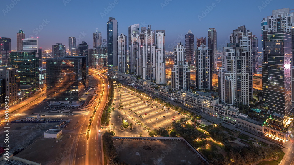Panorama of Business bay Dubai night to day aerial timelapse.