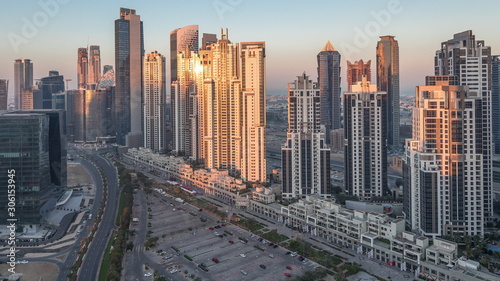 Panorama of Business bay Dubai night to day aerial timelapse.