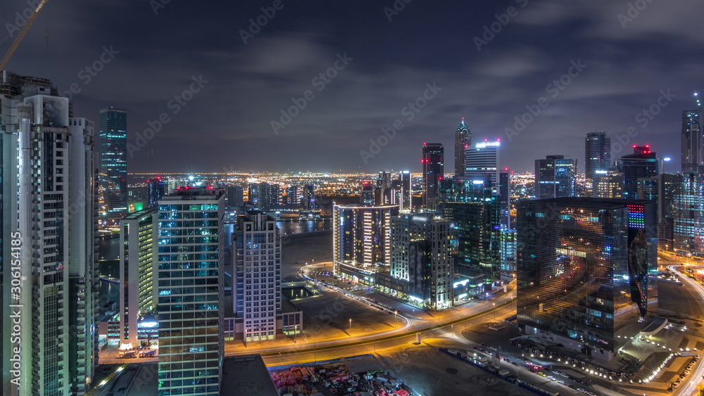 Aerial view of illuminated buildings and high traffic in modern Dubai city, United Arab Emirates Timelapse Aerial