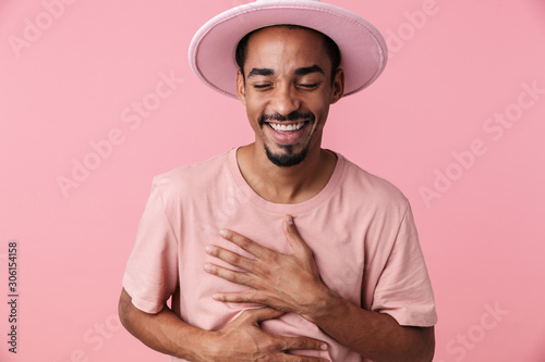 Photo of joyful african american man laughing with eyes closed