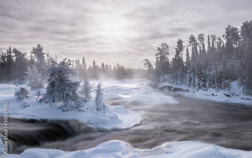Ice fog and hoar frost on a 30 below winter morning at the waterfalls on the Wabigoon River, Northwest Ontario, Canada. photo