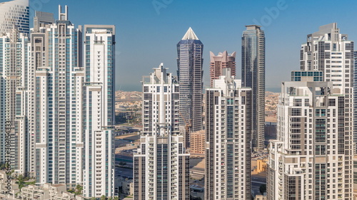 Modern residential and office complex with many towers aerial timelapse at Business Bay, Dubai, UAE. © neiezhmakov