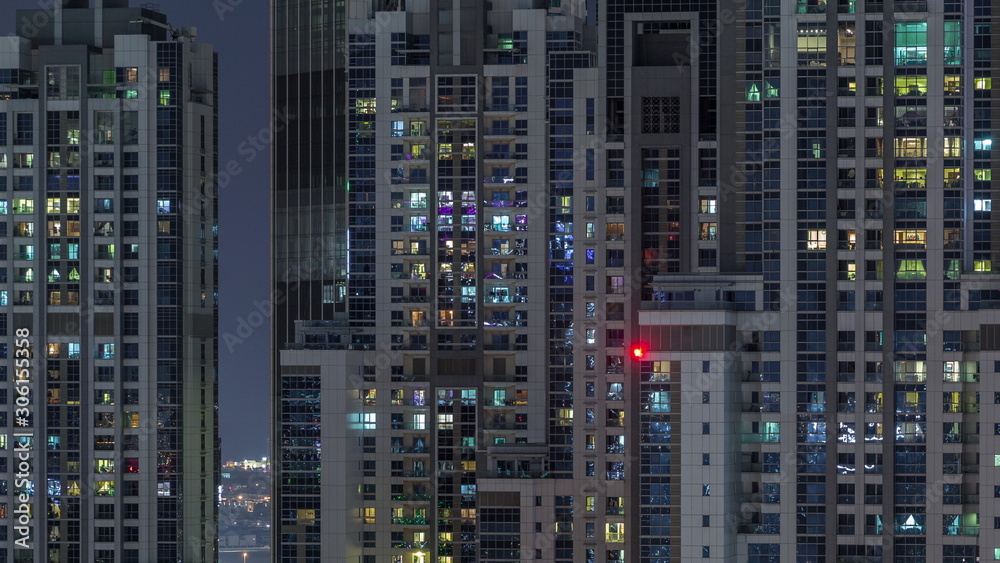 Lights from windows of offices in Dubai Aerial Timelapse