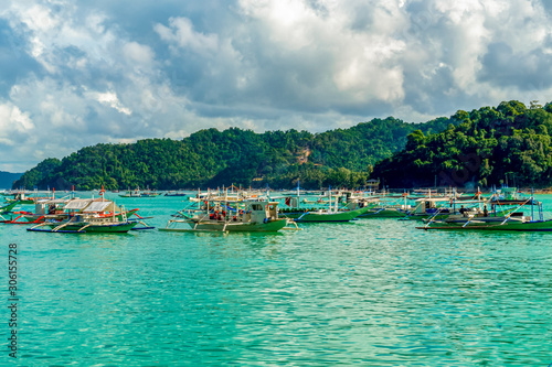 Local boats (bancas) in El Nido bay in Palawan, Philippines. Holiday and vacation.