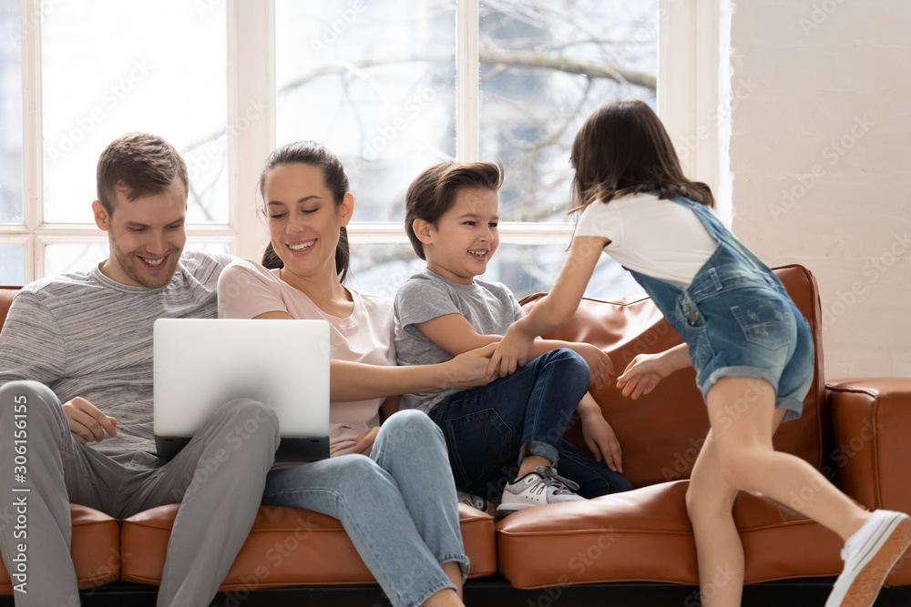 Happy family have fun relaxing at home together Happy family have fun relaxing at home together
