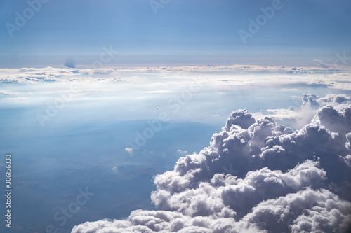 A group of dark clouds and a view of the horizon