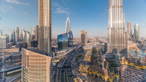 Panoramic skyline view of Dubai downtown with mall, fountains and skyscrapers aerial timelapse