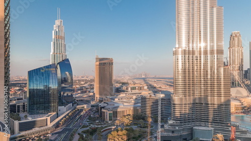 Panoramic skyline view of Dubai downtown with mall  fountains and skyscrapers aerial timelapse
