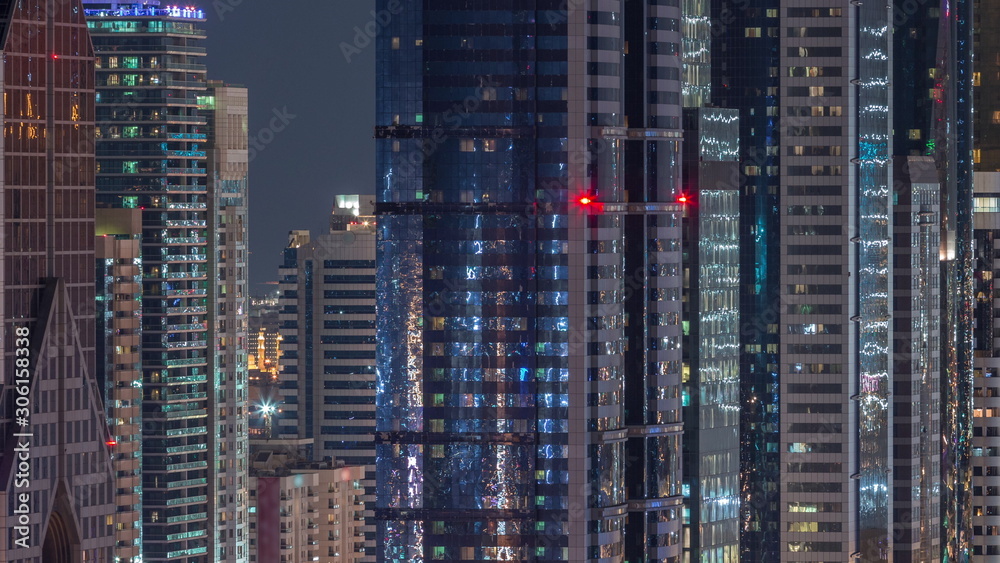 Dubai International Financial Centre district with modern skyscrapers night timelapse