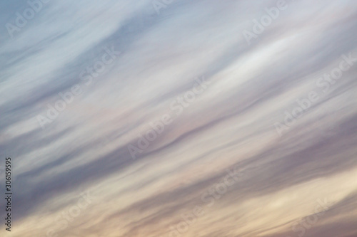 Looking up at a full frame photograph of wispy clouds and sky