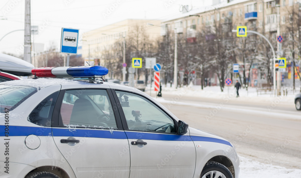traffic police car with photo and video recording stands for observation in front of the city pedestrian crossing in the winter traffic police car with photo and video recording stands for observation in front of the city pedestrian crossing in the winter