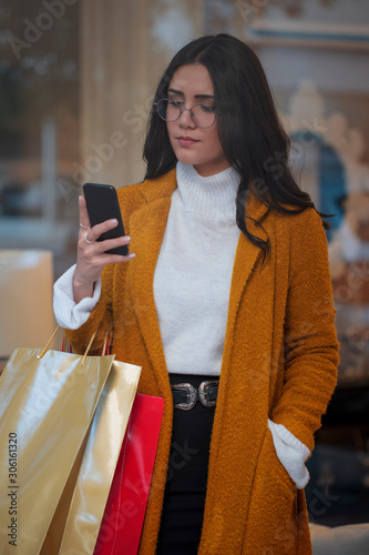young woman with shopping bags