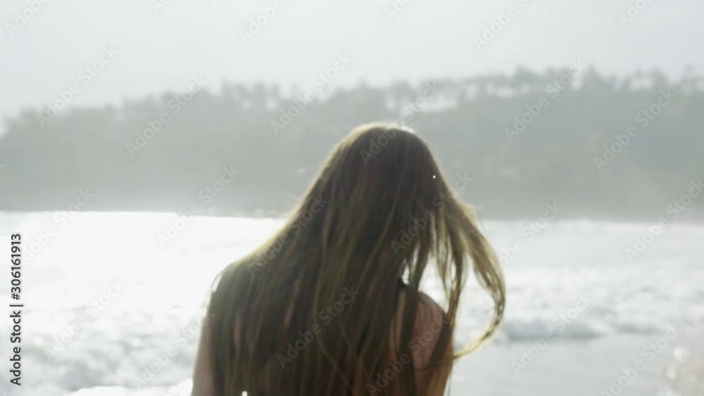 Beautiful sports girl on the beach of Srilanka walks in a swimsuit, the ocean Beautiful sports girl on the beach of Srilanka walks in a swimsuit, the ocean
