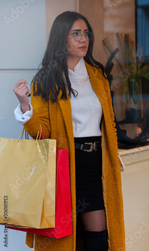 young woman with shopping bags
