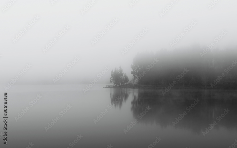 misty lake in the morning.
