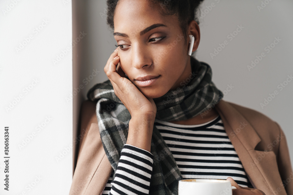Beautiful young african woman wearing autumn outfit Beautiful young african woman wearing autumn outfit