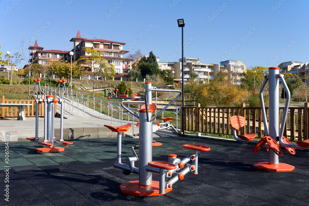 Sports ground with exercise equipment in a public park on a sunny autumn day in a seaside village in Bulgaria. Sports ground with exercise equipment in a public park on a sunny autumn day in a seaside village in Bulgaria.