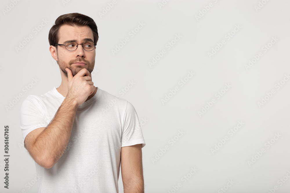 Pensive man in glasses look at blank copy space thinking Pensive man in glasses look at blank copy space thinking