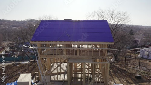 Wallpaper Mural Aerial panoramic view of new wooden house under construction. Roof is covered with insulation material, the roof base. Torontodigital.ca
