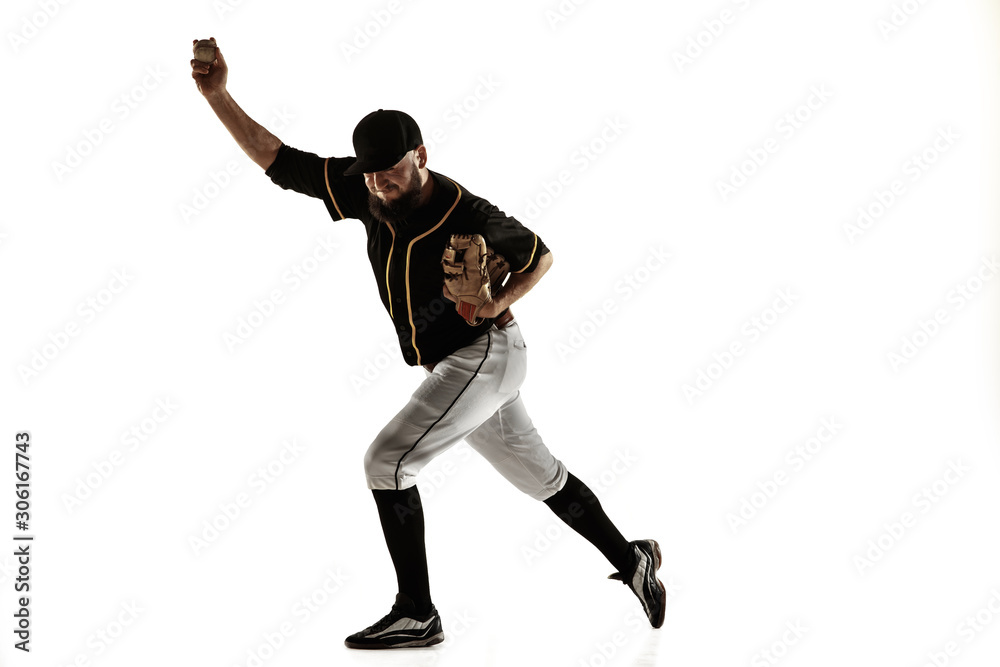 Baseball player, pitcher in a black uniform practicing and training isolated on a white background. Young professional sportsman in action and motion. Healthy lifestyle, sport, movement concept. Baseball player, pitcher in a black uniform practicing and training isolated on a white background. Young professional sportsman in action and motion. Healthy lifestyle, sport, movement concept.