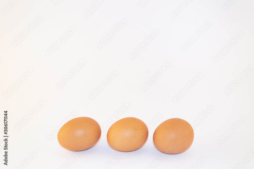 Three chicken eggs isolated on white background. Studio shot Three chicken eggs isolated on white background. Studio shot