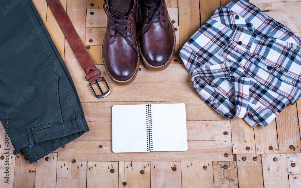 men's stylish winter clothes and Blank white notebook . winter fashion men's stylish winter clothes and Blank white notebook . winter fashion
