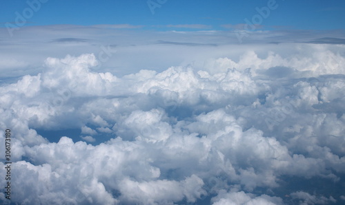 Blue sky and clouds, View from window of airplane.