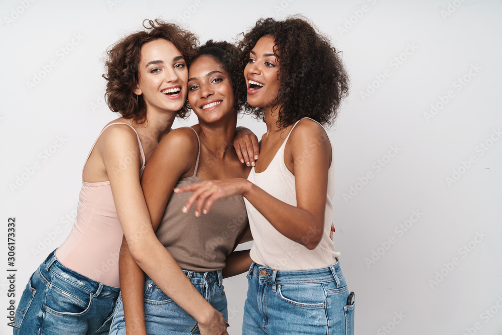 Portrait of joyful multiethnic women standing and laughing together - obrazy, fototapety, plakaty 