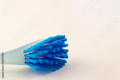 Blue plastic brush for dish isolated on white background. Equipment for cleaning