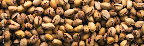 Pistachio nuts in shell. Panorama. Background. Texture.	