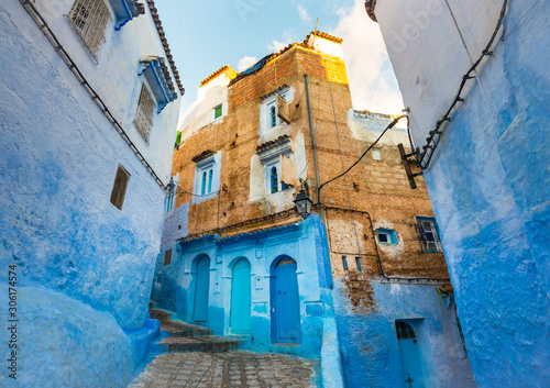 Chefchaouen city street with blue walls and beautiful windows in Morocco © leelook