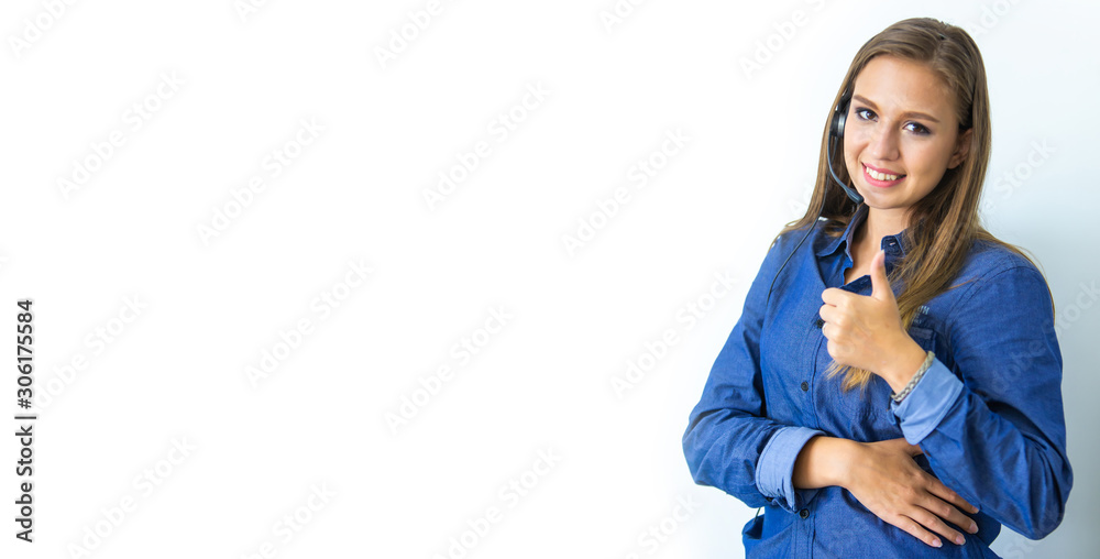 Beautiful consultant of call center in headphones.  Portrait of smiling female customer using headset at call center office