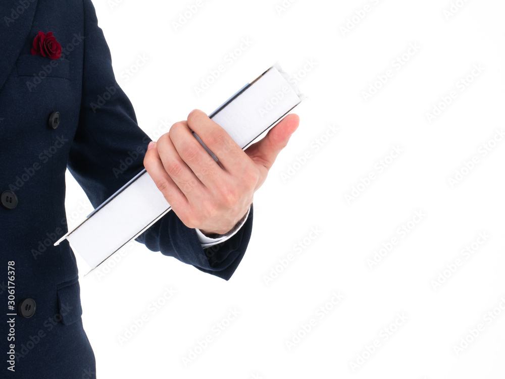 Smart caucasian gentleman holding education book on his hand closeup shot for study business strategy from library and wear elegant midnight blue blazer suit clothing on white isolated background Smart caucasian gentleman holding education book on his hand closeup shot for study business strategy from library and wear elegant midnight blue blazer suit clothing on white isolated background