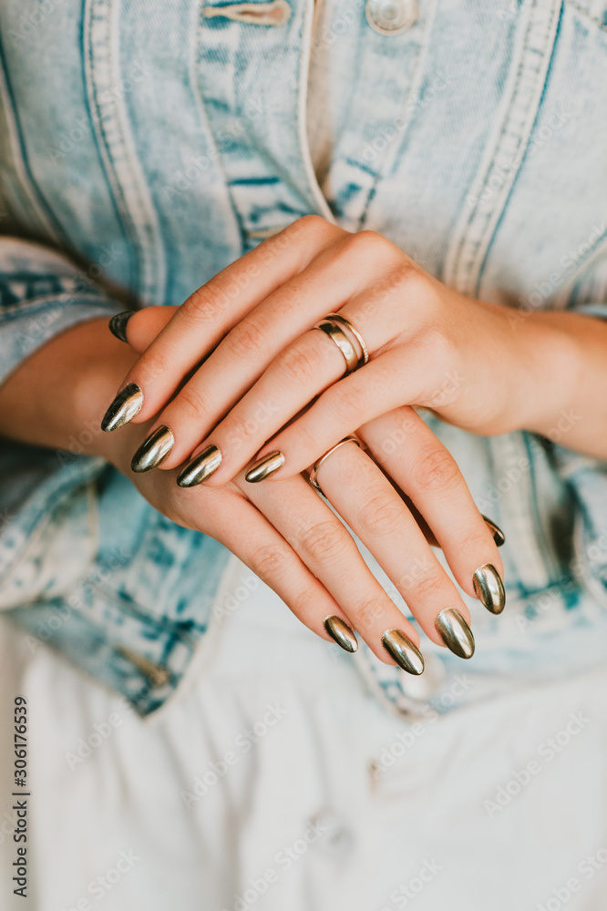 Fototapeta Stylish trendy female mirror manicure, metal nail art