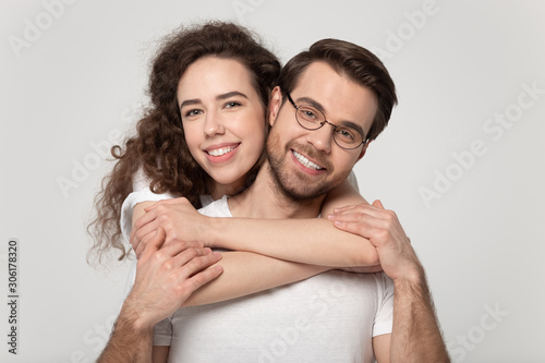 Portrait of happy loving couple posing looking at camera