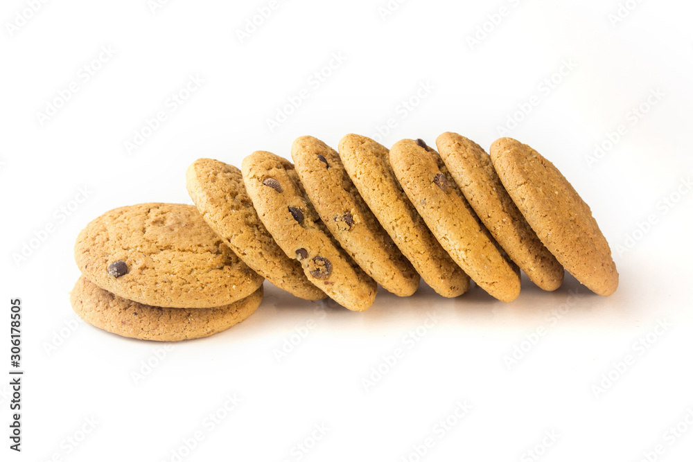 Oatmeal cookies with chocolate chips lie sideways on a white background. Oatmeal cookies with chocolate chips lie sideways on a white background.